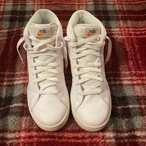 White and yellow nike sneakers